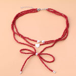 Collier Perles Nœud & Pendentifs Cœur