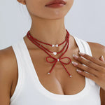 Collier Perles Nœud & Pendentifs Cœur