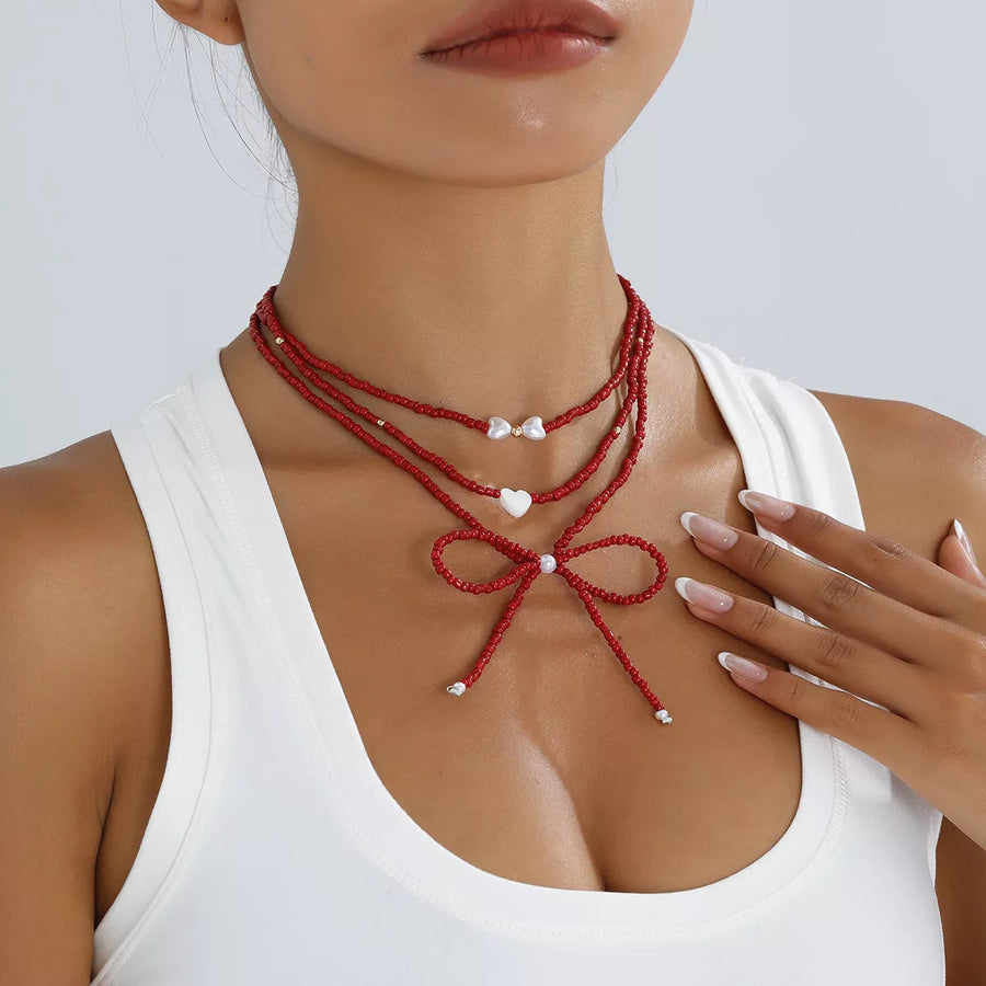 Collier Perles Nœud & Pendentifs Cœur