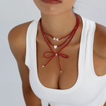 Collier Perles Nœud & Pendentifs Cœur