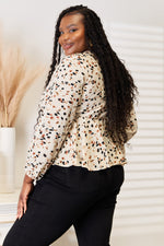 Blouse Peplum Nouée Décolleté Plongeant Imprimée