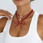 Collier Perles Nœud & Pendentifs Cœur