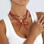 Collier Perles Nœud & Pendentifs Cœur